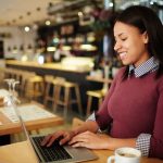 latino founder on laptop