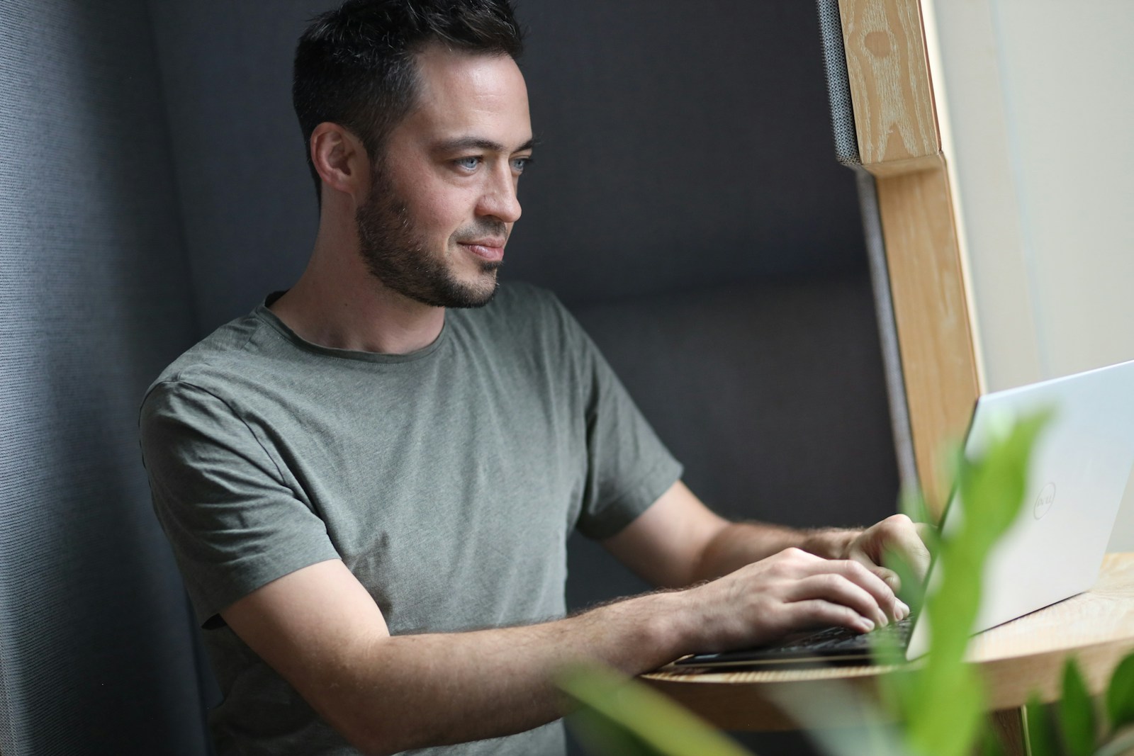 Image of a founder typing business idea on a laptop; follow passion dangerous advice