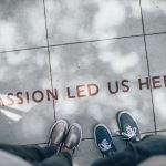 two person standing on gray tile paving; obsession changes your life