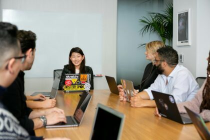 People in a meeting discussing app development; emotional honesty advantage