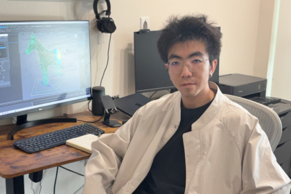 Movie director sitting in office posing for headshot; rigging systems visual effects